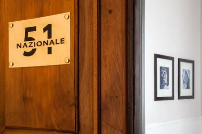 a wooden door with a sign that reads kryptonite at Nazionale 51 Group in Rome