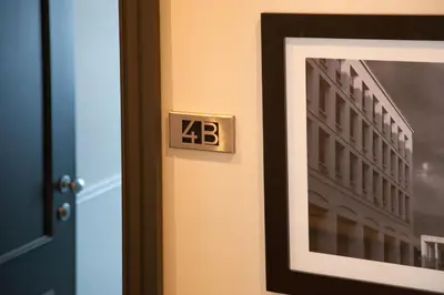 a clock on a door next to a picture of a building at Nazionale 51 Group in Rome
