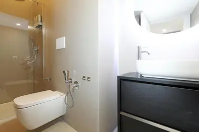 a bathroom with a white toilet and a sink at LC GrandTour Libertà in Rome