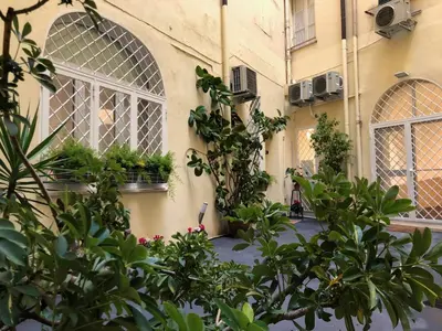 a building with windows and plants in front of it at Lata Rana Colosseum Luxury Loft in Rome