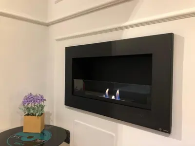 a fireplace in a living room with a fire place at Lata Rana Colosseum Luxury Loft in Rome