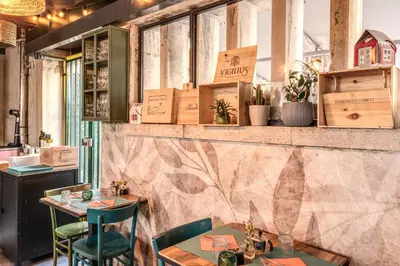 a restaurant with two tables and chairs in a room at Apollo Boutique Hotel in Rome