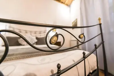 a close up of a metal bed in a bedroom at Vicolo dell'Aquila - Residenze Romanae in Rome