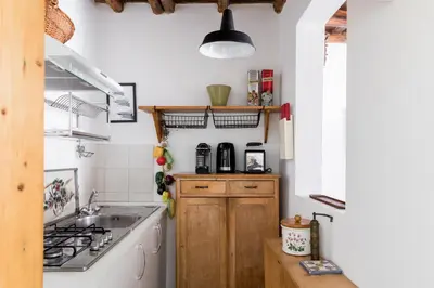 a kitchen with a sink and a stove at Classic and chic apartments in Trastevere in Rome