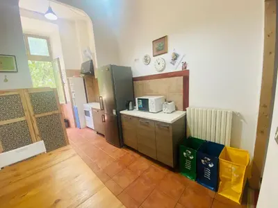 a kitchen with a refrigerator and a counter top at ROMA GONDOLA SRLS in Rome