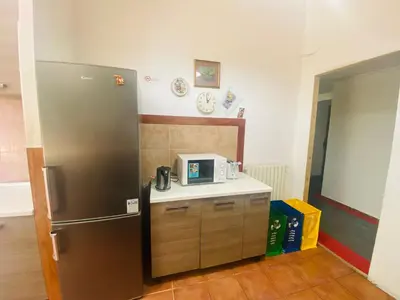 a kitchen with a stainless steel refrigerator and a counter at ROMA GONDOLA SRLS in Rome