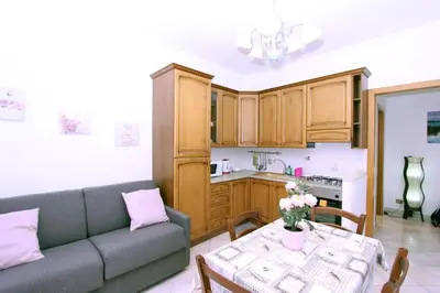 a living room with a couch and a table at Torrigio Flat in Rome