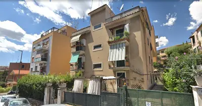a building with a fence in front of it at Torrigio Flat in Rome