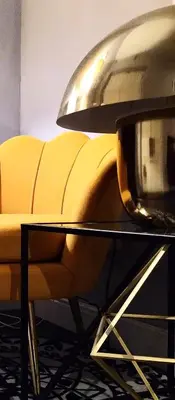 a yellow couch and a table with a lamp at NIK Rooms in Rome