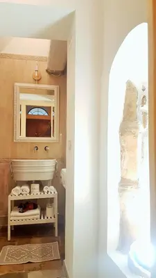 a bathroom with a sink and a mirror at Colosseo Sweet Home in Rome