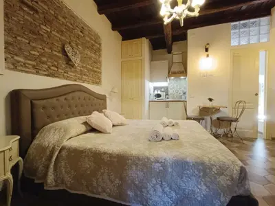 a bedroom with a bed with two towels on it at Colosseo Sweet Home in Rome