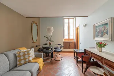 a living room with a couch and a table at iFlat Pantheon Historic Two-Story Apartment in Rome
