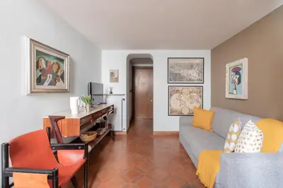 a living room with a couch and a table at iFlat Pantheon Historic Two-Story Apartment in Rome