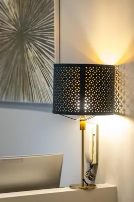 a lamp sitting on top of a table at Suites 44 - Guesthouse close to Vaticano, San Pietro, Castel Sant'angelo in Rome
