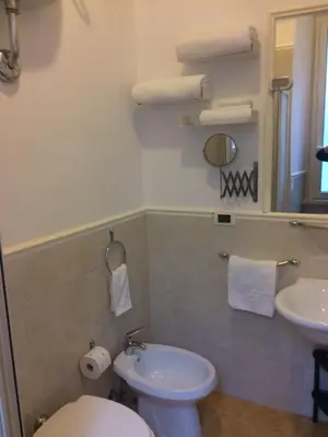 a bathroom with a toilet and a sink at Comfort spazio e privacy 2 camere 2 bagni e self check in nel cuore di San Giovanni in Rome