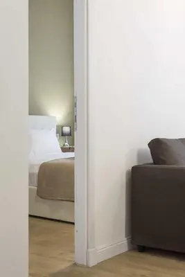 a bedroom with a bed and a couch in a room at Corso 101 in Rome