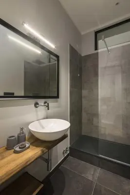 a bathroom with a white sink and a shower at Corso 101 in Rome