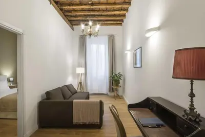 a living room with a couch and a table at Corso 101 in Rome