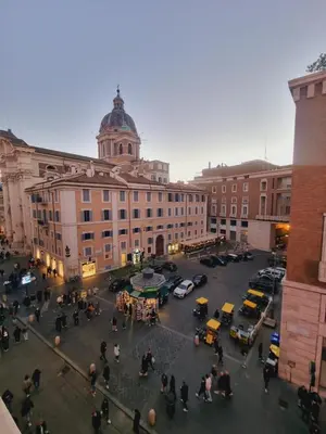 a group of people standing in front of a building at Corso 101 in Rome