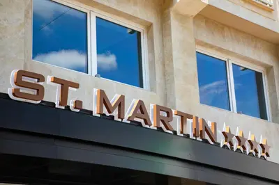 a sign on the front of a star marriott building at Hotel St Martin by OMNIA hotels in Rome