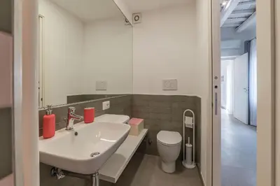 a bathroom with a sink and a toilet at GuestHost - Piazza Navona Panoramic Penthouse in Rome