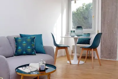 a living room with a couch and chairs and a table at RENOVATED AND COZY FLAT in Rome
