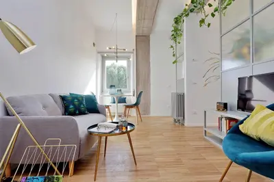a living room with a couch and a table at RENOVATED AND COZY FLAT in Rome