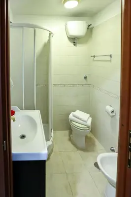 a bathroom with a toilet and a sink at Lydka Domus in Rome