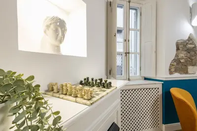 a living room with a chess board on a table at Boutique Apartment Pantheon in Rome