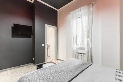 a bedroom with a large bed and a window at Benincasa Bed&Breakfast in Rome