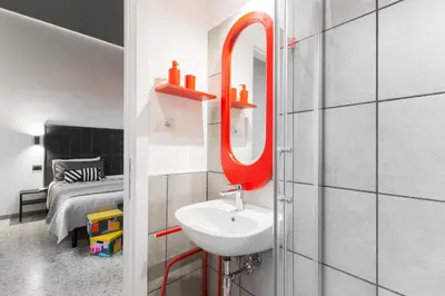 a bathroom with a sink and a mirror at Benincasa Bed&Breakfast in Rome
