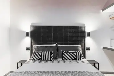 a bedroom with a large bed with two pillows at Benincasa Bed&Breakfast in Rome