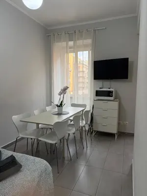 a bedroom with a bed with a black and white blanket at Roman Art Apartment - Metro C to Colosseum in Rome