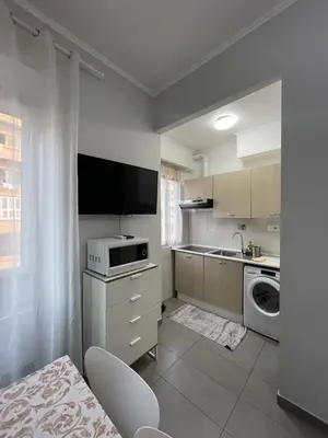 a kitchen with a washing machine and a sink at Roman Art Apartment - Metro C to Colosseum in Rome