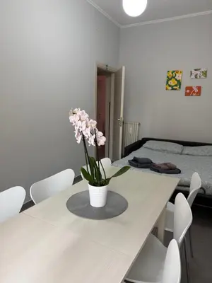 a bedroom with a bed with a black and white blanket at Roman Art Apartment - Metro C to Colosseum in Rome