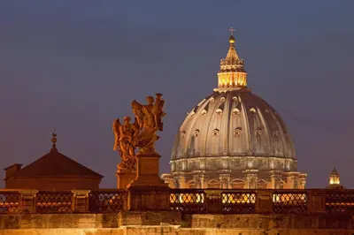a domed building with a statue on top of it at Living by Vatican with panoramic terraces in Rome in Rome