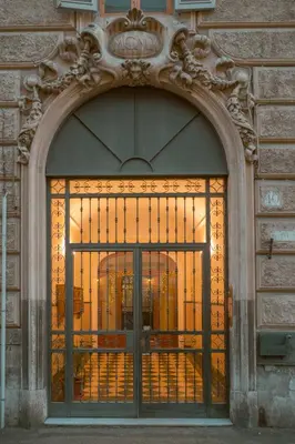 an entrance to a building with a large glass door at Living by Vatican with panoramic terraces in Rome in Rome