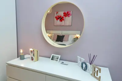 a room with a mirror and a white dresser at Elegant 3-Bed Apartment 10' Termini Wi-Fi AC in Rome