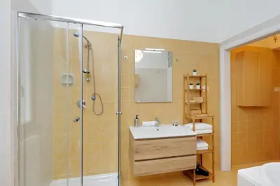 a bathroom with a shower and a sink at Elegant 3-Bed Apartment 10' Termini Wi-Fi AC in Rome