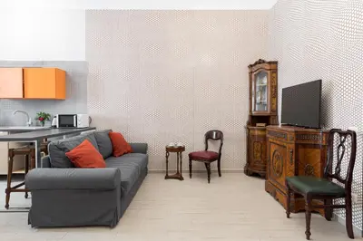 a living room with a couch and a table at Nobile Casa St.Maria in Rome