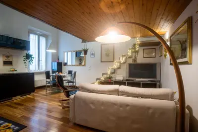 a living room with a couch and a television at Loft in Testaccio in Rome