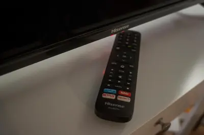 a remote control sitting on top of a computer monitor at Loft in Testaccio in Rome