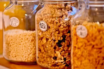 a group of jars filled with different types of food at Argileto Terra in Rome