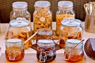a group of jars of pickles on a table at Argileto Terra in Rome