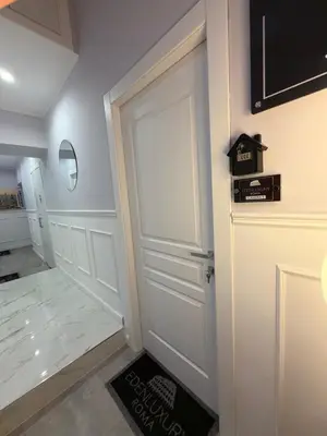 a room with a white door and a box on the wall at IHH COLLECTION - Eden Luxury Roma in Rome
