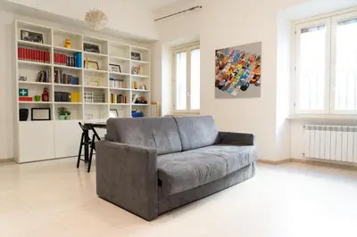 a living room with a couch and a table at SvHome in Rome