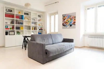 a living room with a couch and a table at SvHome in Rome