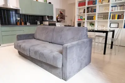 a grey couch in a kitchen with a table at SvHome in Rome