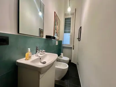a bathroom with a sink and a toilet at Casa Pinturicchio in Rome