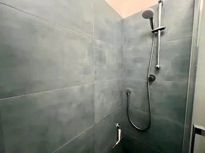 a bathroom with a shower with a shower head at Casa Pinturicchio in Rome
